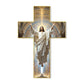 An old wooden wall cross with the image of Jesus Christ